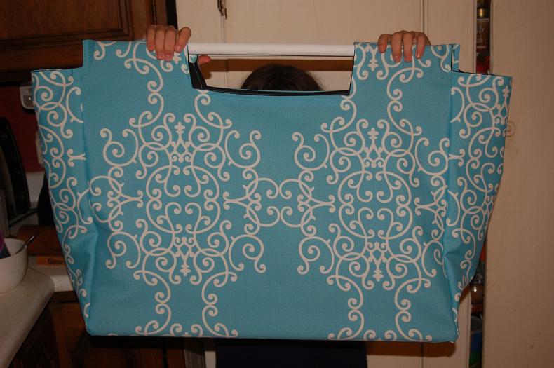 large tote or bag with two long sticks for handles - Page 2