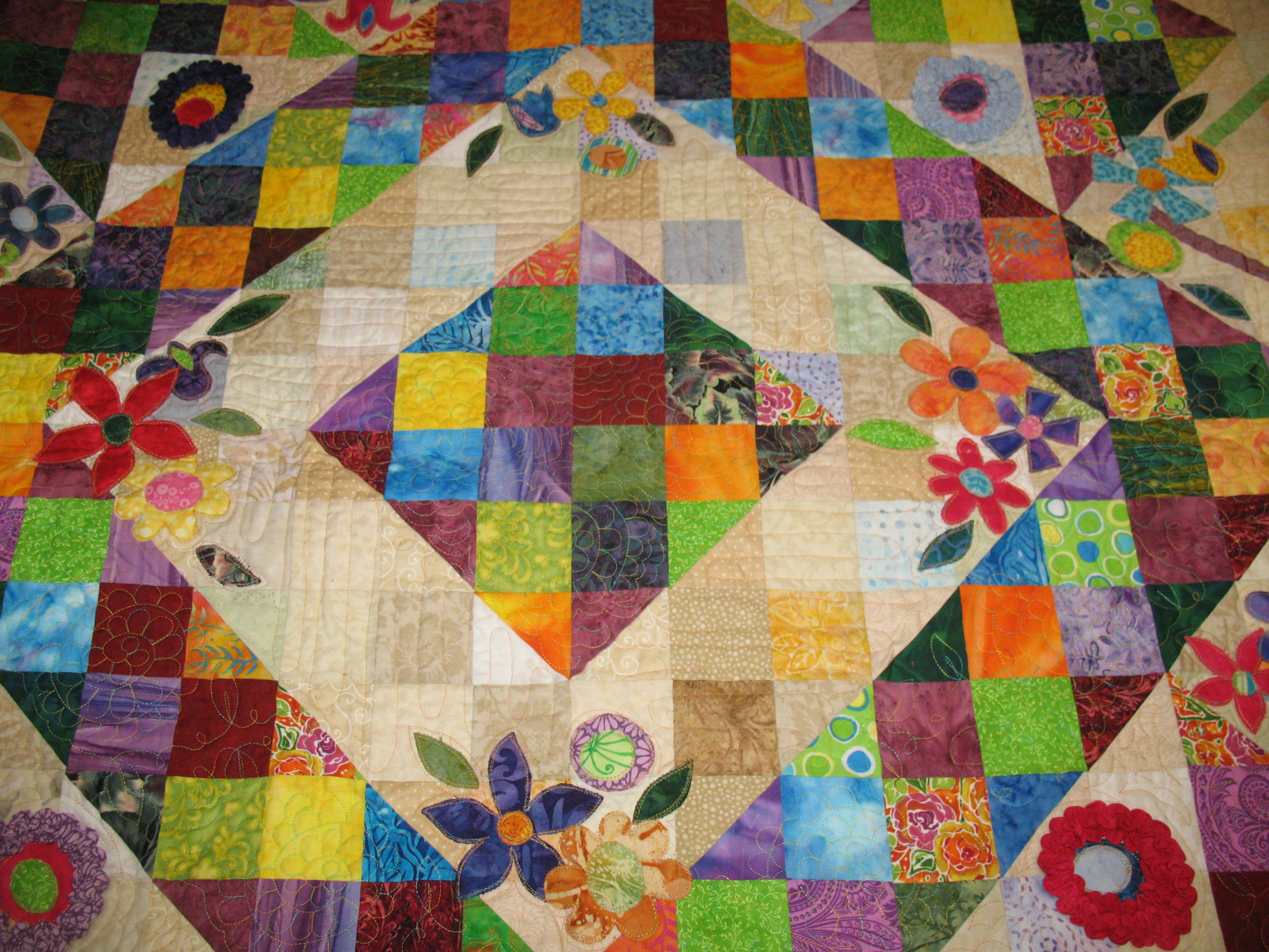 Jewel-Tone scrappy quilt with applique